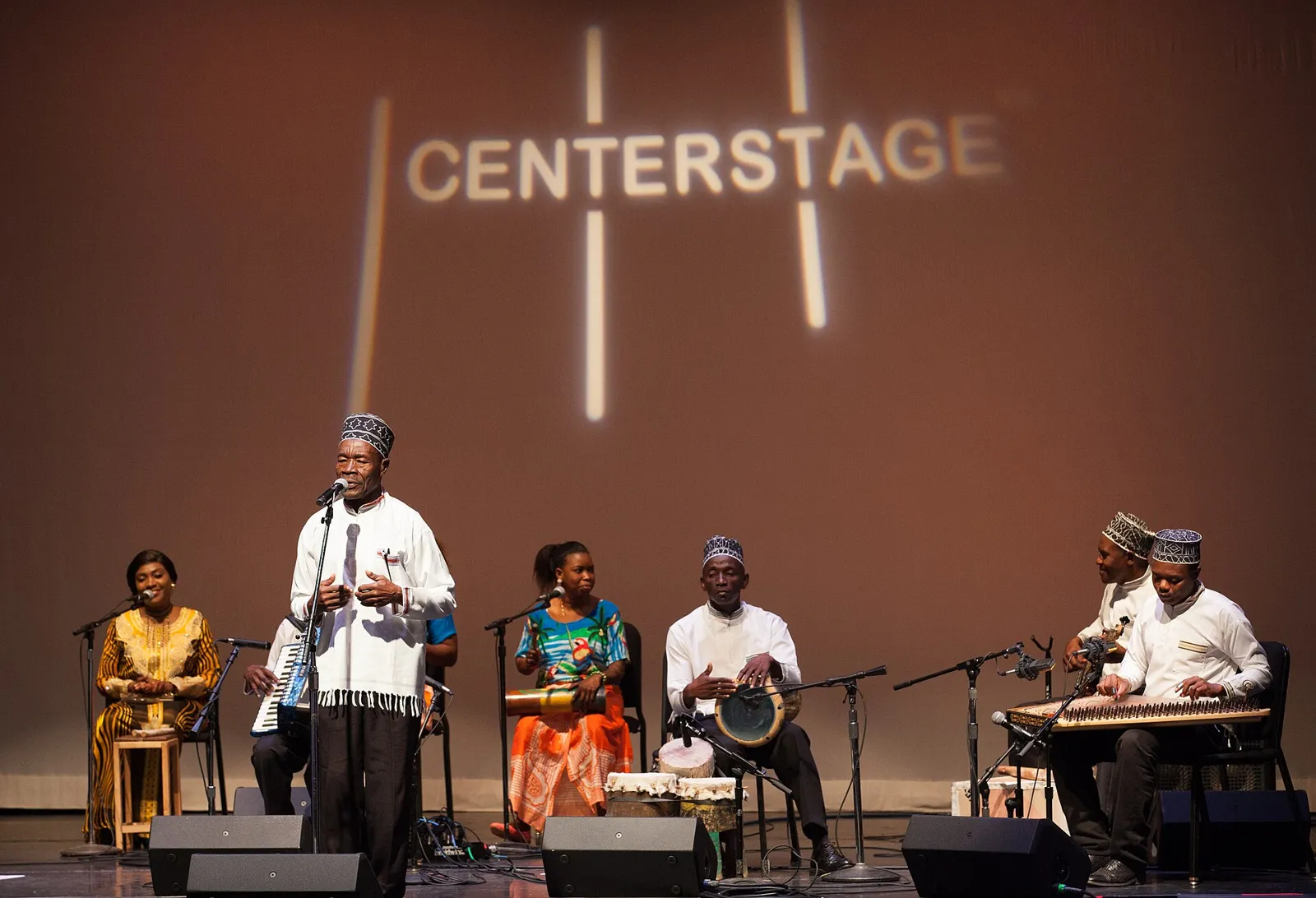 A band performing on a lit stage